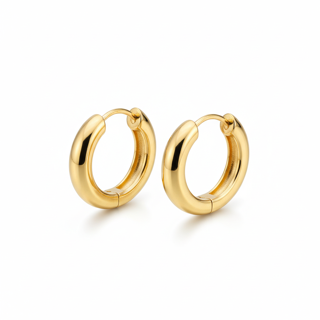 Gold hoop earrings with polished finish on white background